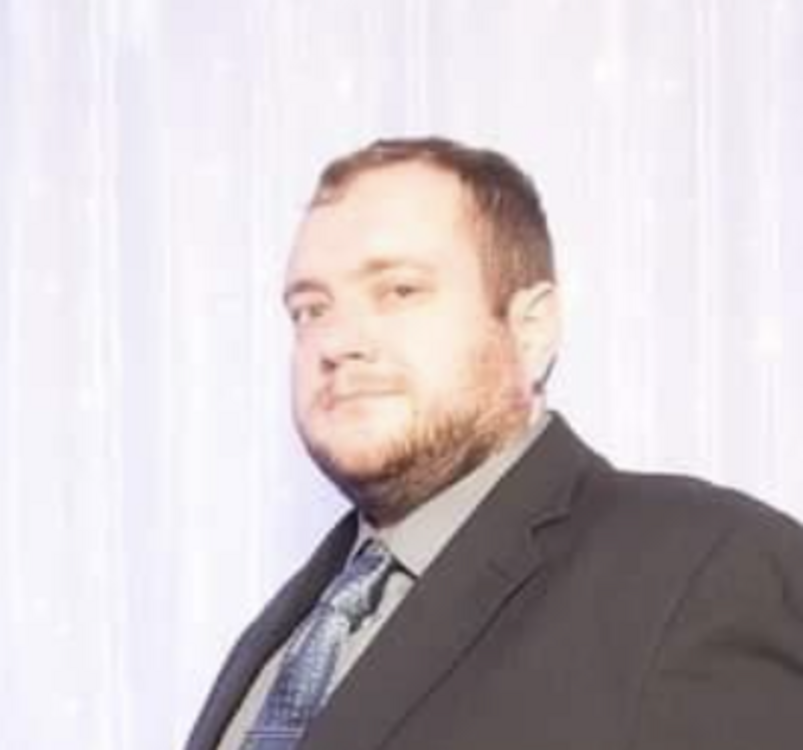 Headshot of Corey